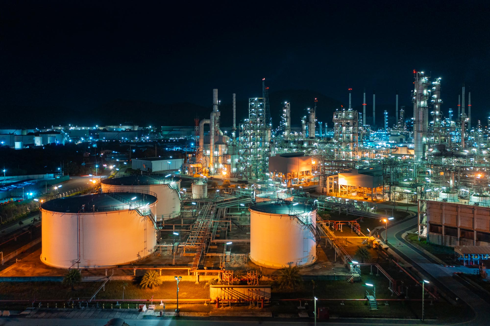 Aerial view Oil refinery factory at dusk for oil or gas and transportation concept background