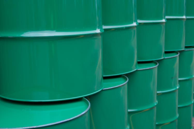 Close up of green oil barrels