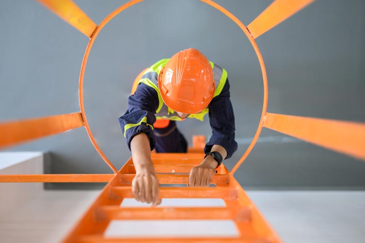 High angle look down view over young Asian technician worker climbing ladder